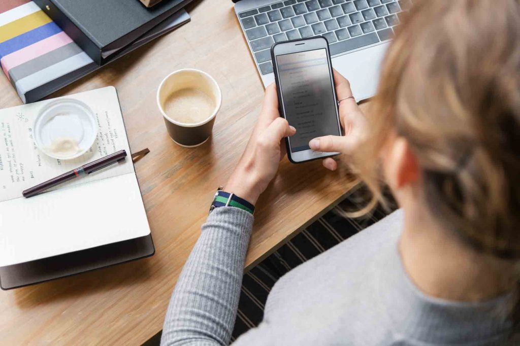 Women with phone and computer