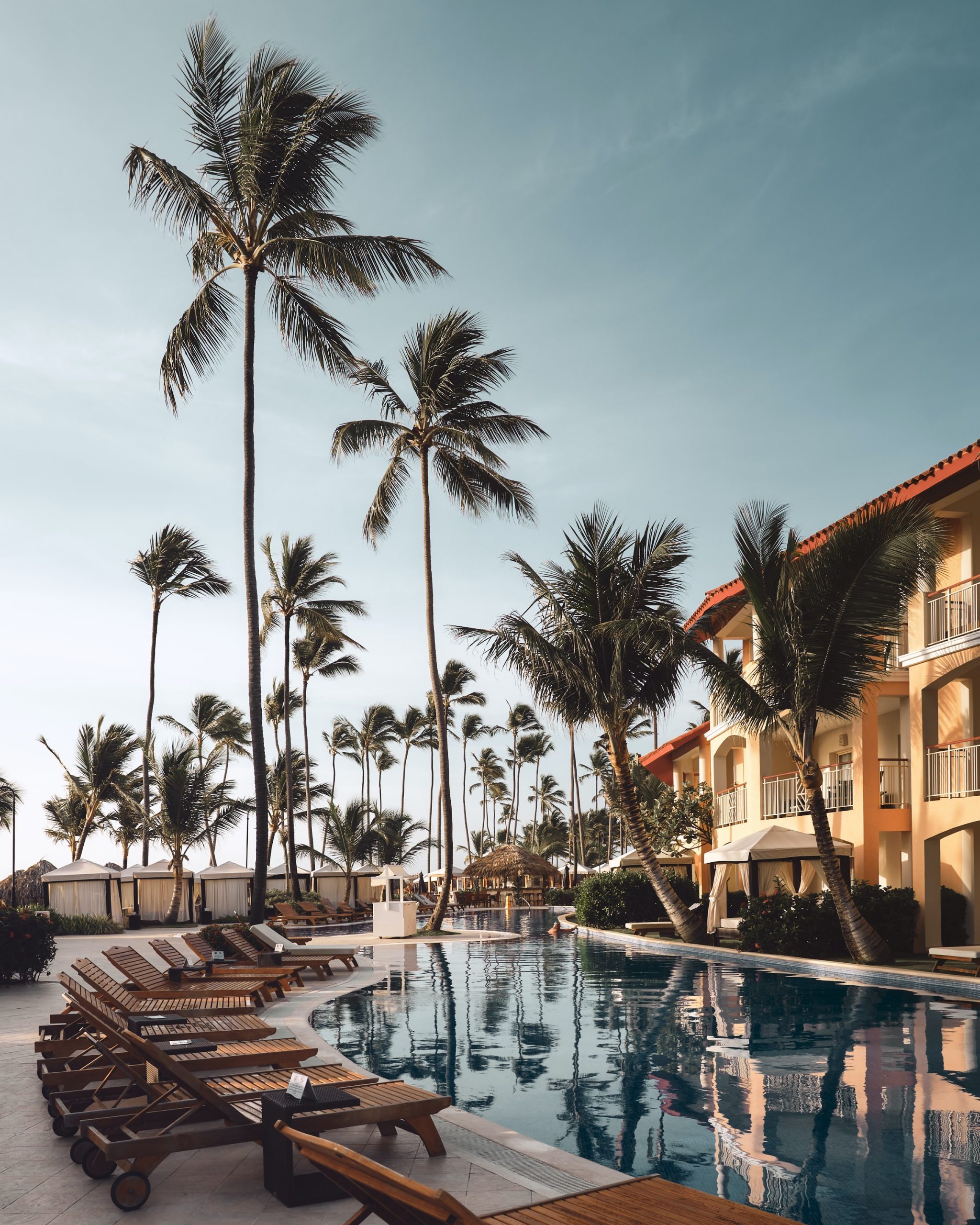 Hotel with palm trees and pool